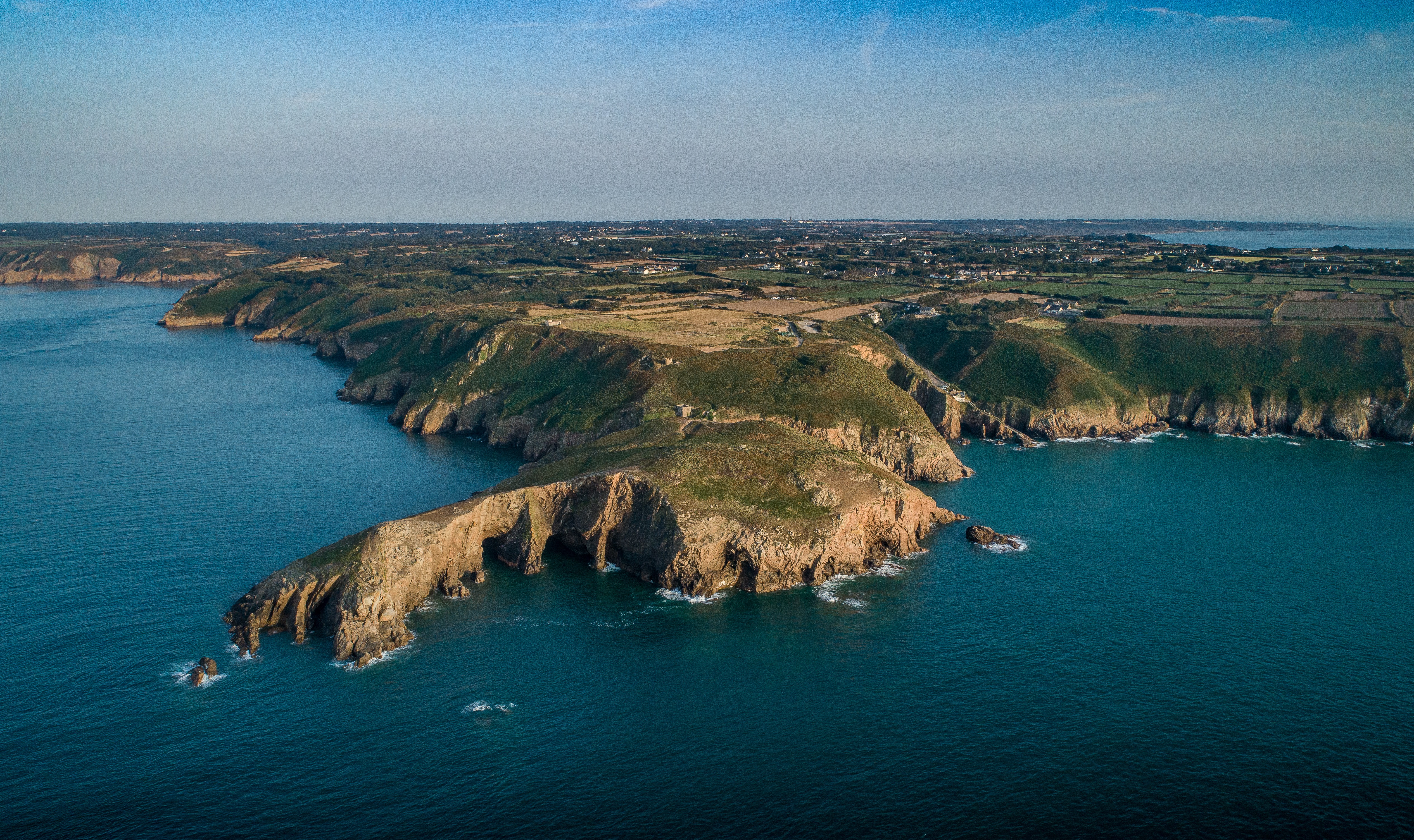 Drone imagery of Jersey's north coast with rocky outcroppings 